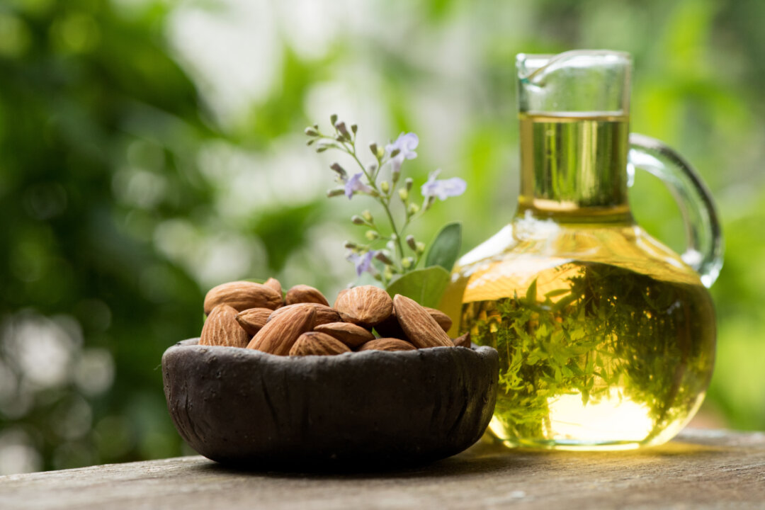 Almond oil is often used in bath oils to soothe and moisturize the skin. wasanajai/Shutterstock
