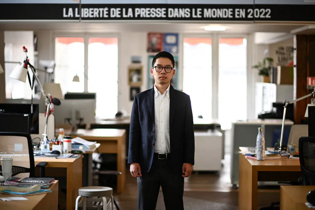 Exiled Hong Kong pro-democracy activist and former legislator Nathan Law poses during a photo session at the Reporters Sans Frontieres (Reporters Without Borders) headquarters in Paris on June 21, 2022. (Christophe Archambault/ AFP)