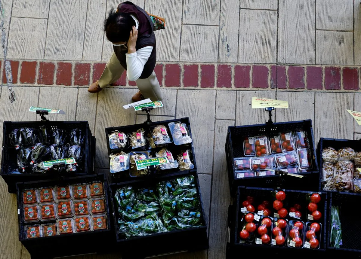 A woman chooses vegetables at a supermarket in Tokyo, Japan October 21, 2022. (Kim Kyung-Hoon/REUTERS)