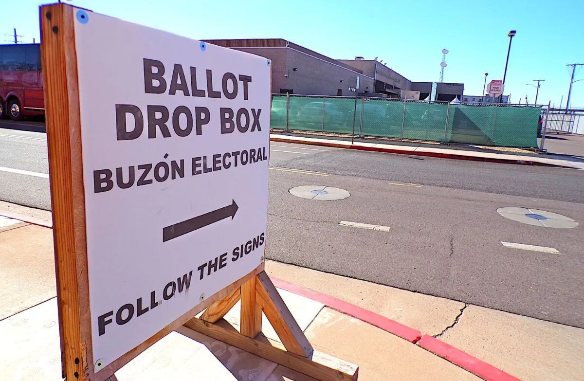 A sign points the way to a ballot drop box inside a secure perimeter of the Maricopa County Sheriff's Office in downtown Phoenix on Oct. 25, 2022. (Allan Stein/The Epoch Times)