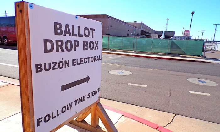 A sign points the way to a ballot drop box inside a secure perimeter of the Maricopa County Sheriff's Office in downtown Phoenix on Oct. 25, 2022. (Allan Stein/The Epoch Times)