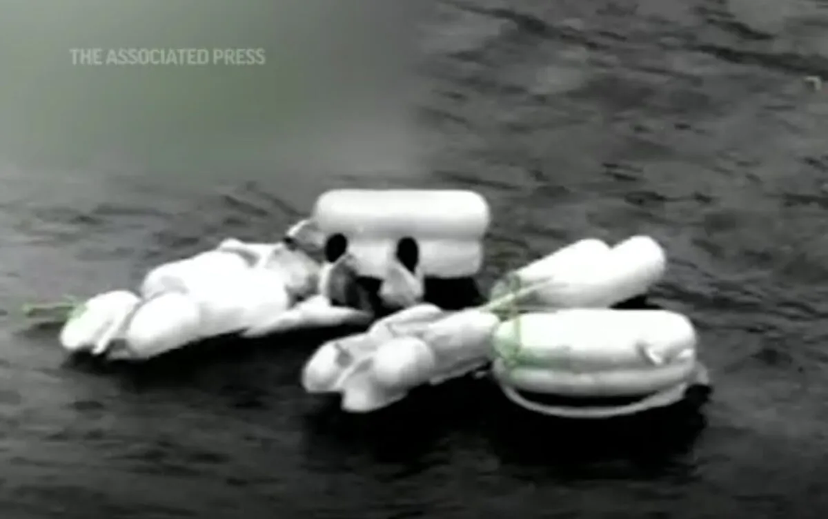 People are being rescued from a helicopter crash in the Gulf of Mexico on Oct. 26, 2022. (US Coast Guard via AP/Screenshot via The Epoch Times)