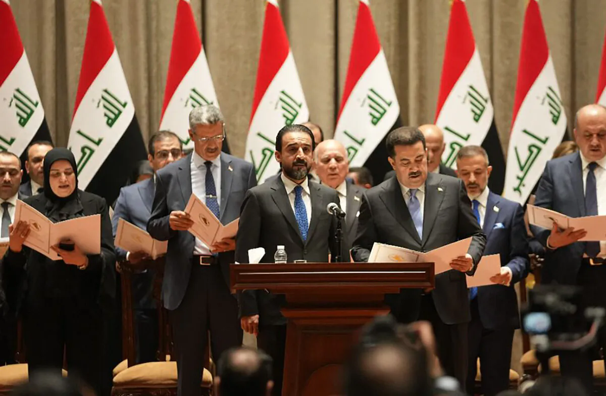 Ministers of the new Iraqi government are being sworn in during the parliamentary session to vote on the new government in Baghdad on Oct. 27, 2022. (Iraqi Parliament Information Office via AP)