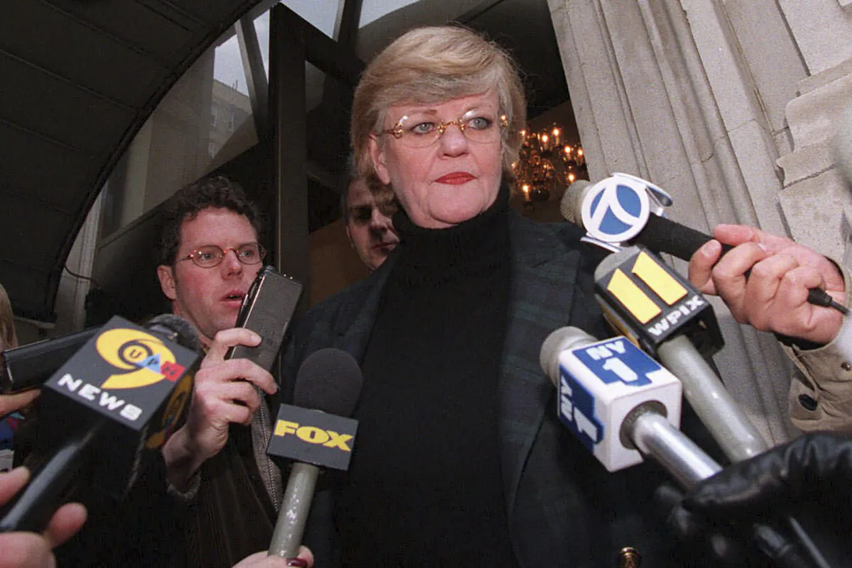New York literary agent Lucianne Goldberg addresses a large assembly of media outside her apartment in New York on Jan. 24, 1998. (Emile Wamsteker/AP Photo)