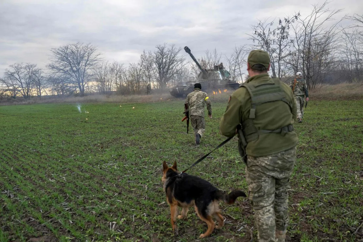 Ukrainian artillery unit members fire towards Kherson outside of Kherson region on Oct. 28, 2022. (Bulent Kilic/AFP via Getty Images)