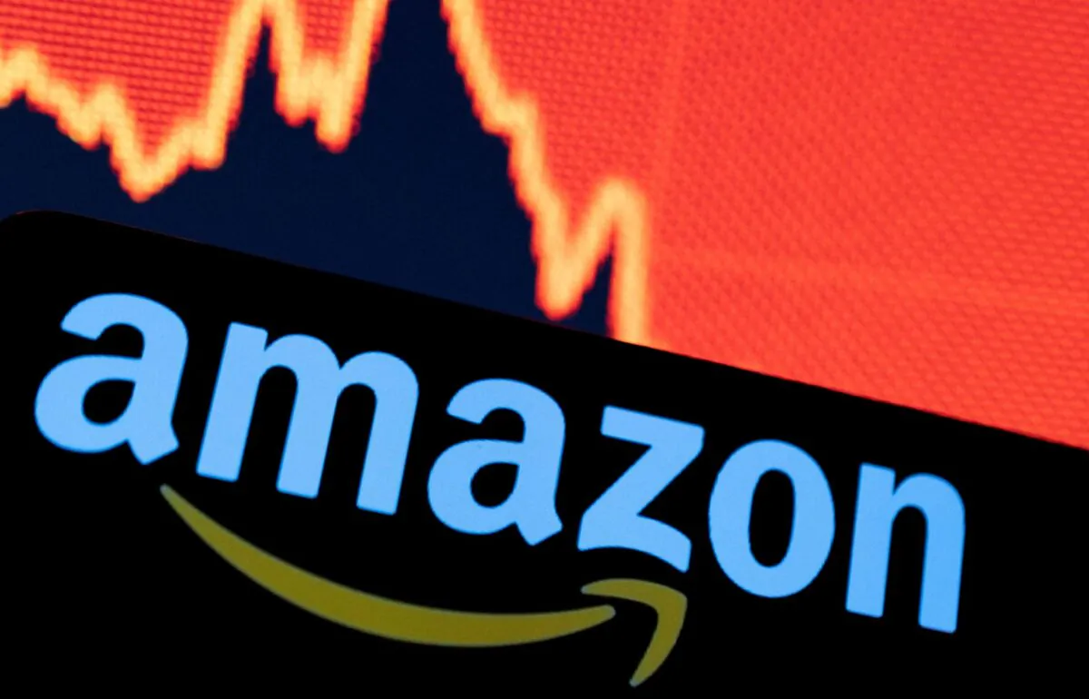 Amazon logo is seen in front of a decreasing stock graph in this illustration taken on April 29, 2022. (Dado Ruvic/Reuters)