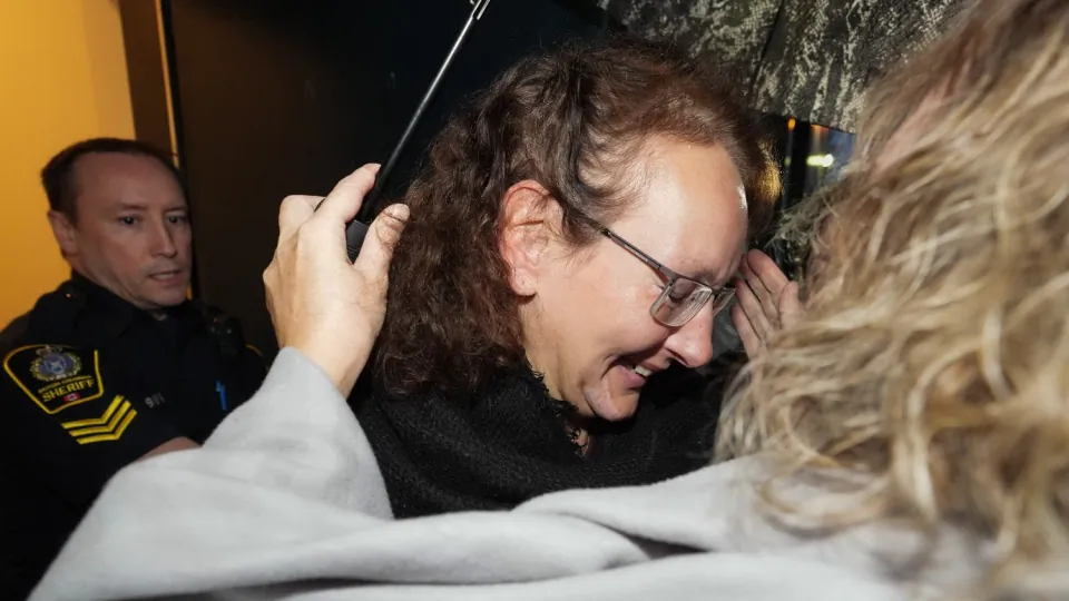 Kimberly Polman smiles as she's greeted by family members after being released from custody at provincial court, in Chilliwack, B.C., on Oct. 27, 2022. (The Canadian Press/Darryl Dyck)
