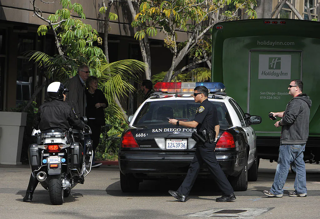 Police search for a suspect in San Diego, Calif., on Feb. 7, 2013. (Denis Poroy/Getty Images)