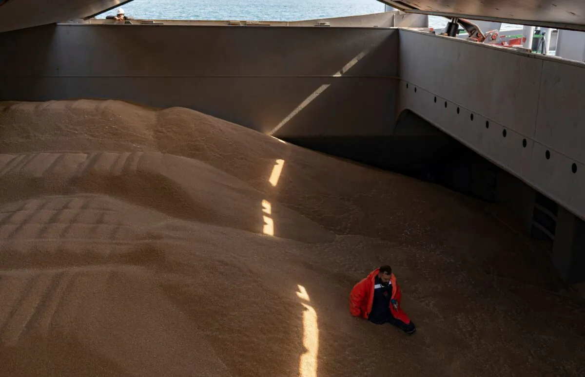 A crew member prepares a grain analysis for a control made by members of the Joint Coordination Center (JCC) onboard the Barbados-flagged ship "Nord Vind" coming from Ukraine, loaded with grain and anchored in Istanbul, on Oct. 11, 2022. (Yasin Akgul/AFP via Getty Images)