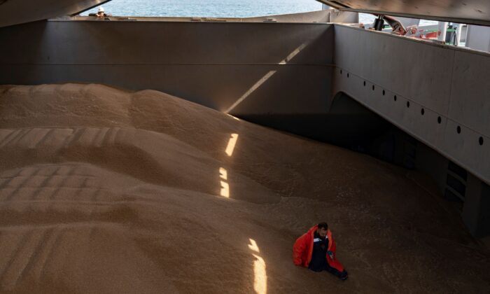 A crew member prepares a grain analysis for a control made by members of the Joint Coordination Center (JCC) onboard the Barbados-flagged ship "Nord Vind" coming from Ukraine, loaded with grain and anchored in Istanbul, on Oct. 11, 2022. (Yasin Akgul/AFP via Getty Images)