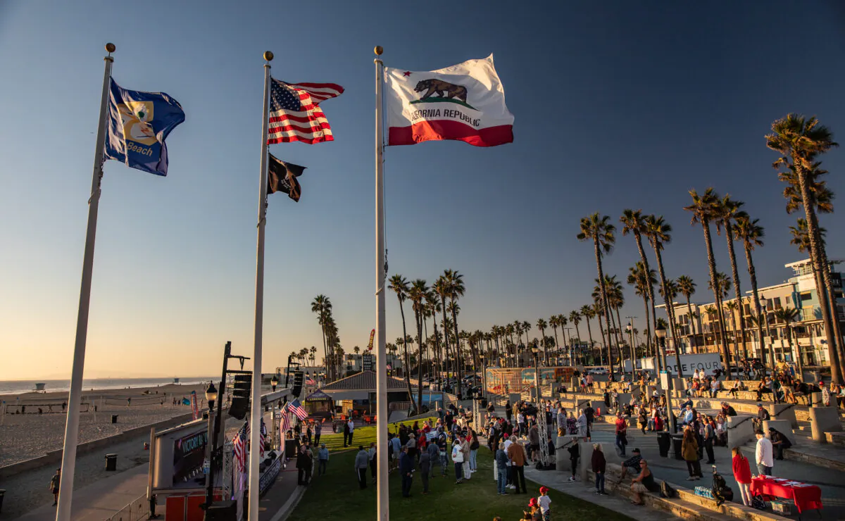 People gather to listen to conservative November election candidates in Huntington Beach, Calif., on Oct. 27, 2022. (John Fredricks/The Epoch Times)
