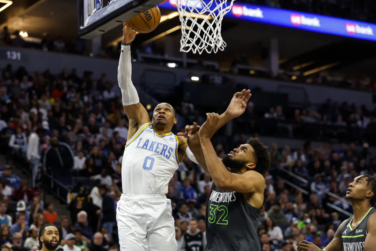 Russell Westbrook (0) of the Los Angeles Lakers goes up for a shot while Karl-Anthony Towns (32) of the Minnesota Timberwolves defends in the fourth quarter of the game at Target Center in Minneapolis, Minn., on Oct. 28, 2022. (David Berding/Getty Images)