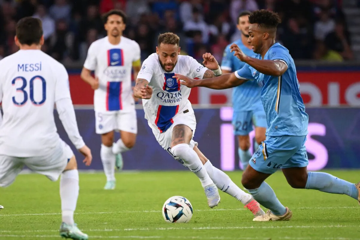 Paris Saint-Germain's Brazilian forward Neymar (C) fights for the ball with Troyes' US defender Erik Palmer Browen (R) during the French L1 football match between Paris Saint-Germain (PSG) and ES Troyes AC at The Parc des Princes Stadium in Paris on Oct. 29, 2022. (Anne-Christine Poujoulat/AFP via Getty Images)