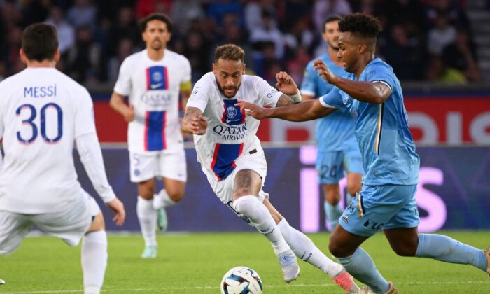 Paris Saint-Germain's Brazilian forward Neymar (C) fights for the ball with Troyes' US defender Erik Palmer Browen (R) during the French L1 football match between Paris Saint-Germain (PSG) and ES Troyes AC at The Parc des Princes Stadium in Paris on Oct. 29, 2022. (Anne-Christine Poujoulat/AFP via Getty Images)