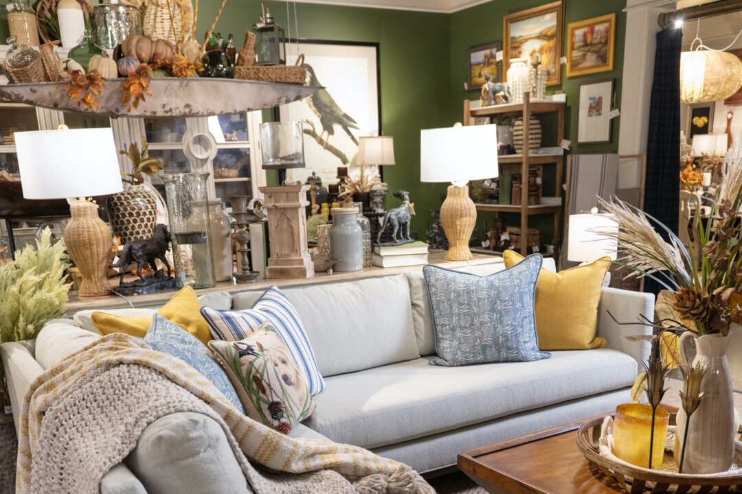 Two layered throw blankets are casually draped over the edge of this sofa for additional texture and interest. (Handout/TNS)