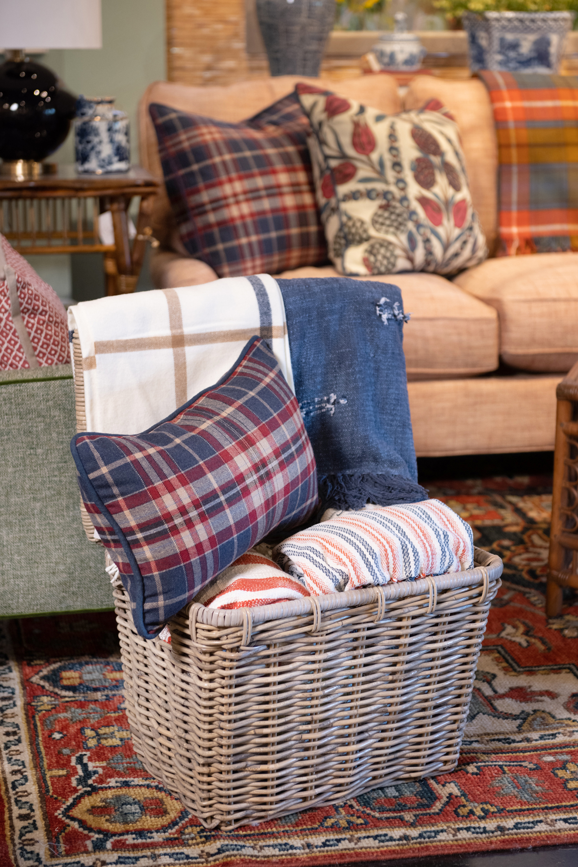 Store extra pillows and blankets in decorative baskets when not in use for an unexpected design element. 