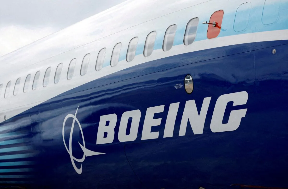 The Boeing logo on the side of a Boeing 737 MAX at the Farnborough International Airshow in Farnborough, Britain, on July 20, 2022. (Peter Cziborra/Reuters)