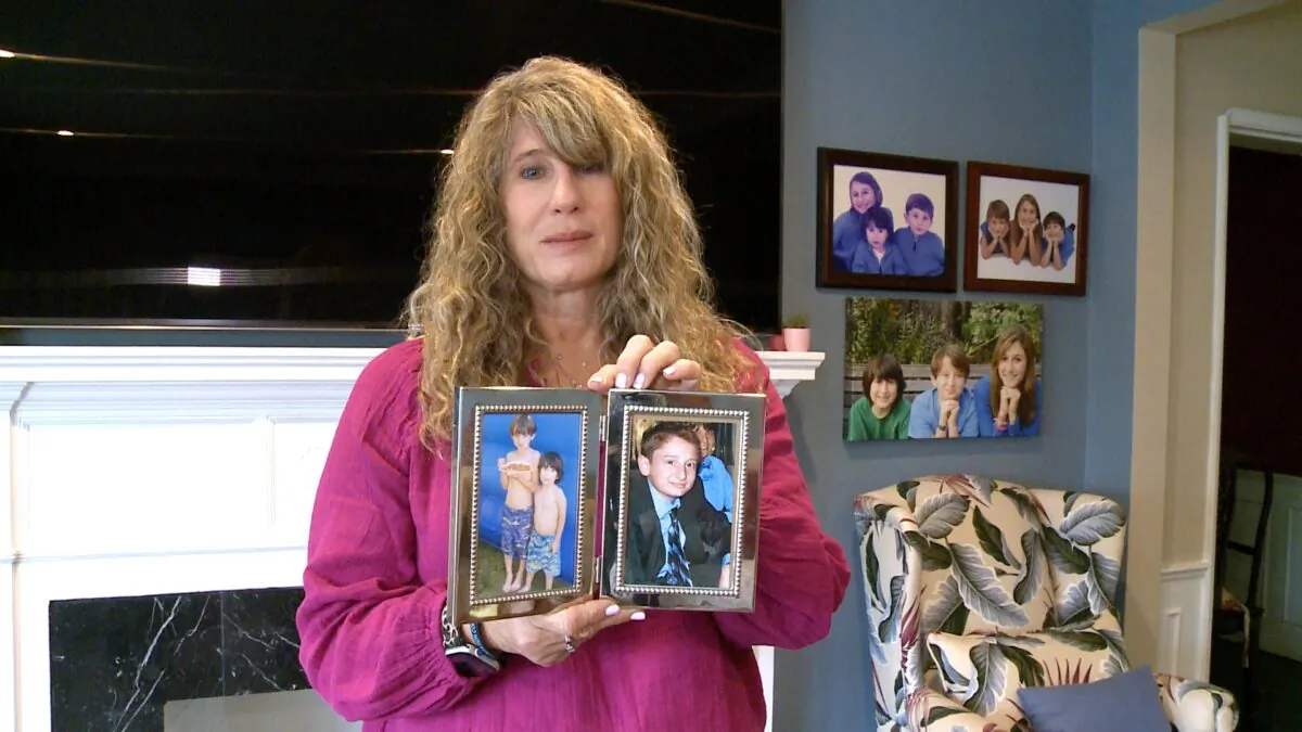Juli Shamash holds photos of her son Tyler, in Los Angeles on Oct. 11, 2022. (Jackie Rios/NTD)
