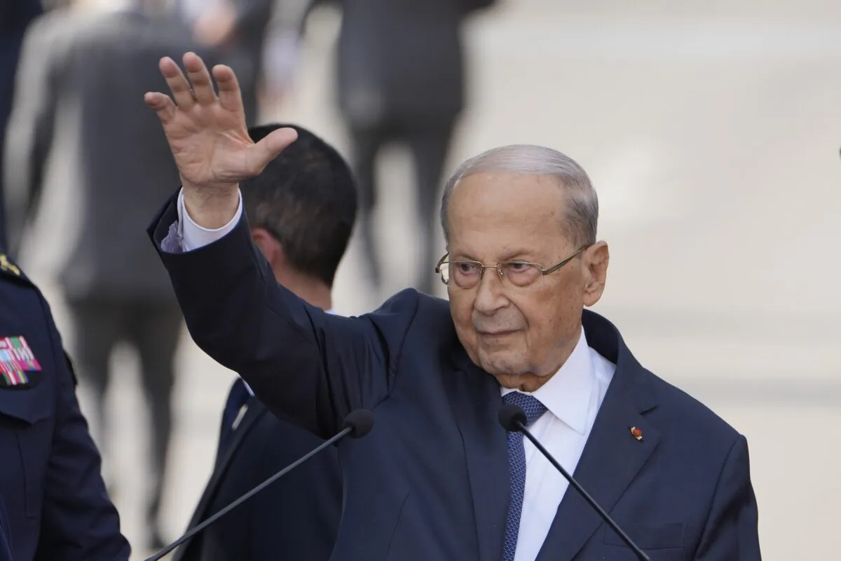 Lebanese President Michel Aoun waves for his supporters during a speech to his supporters gathered outside the presidential palace in Baabda, east of Beirut, on Oct. 30, 2022. (Bilal Hussein/AP Photo)