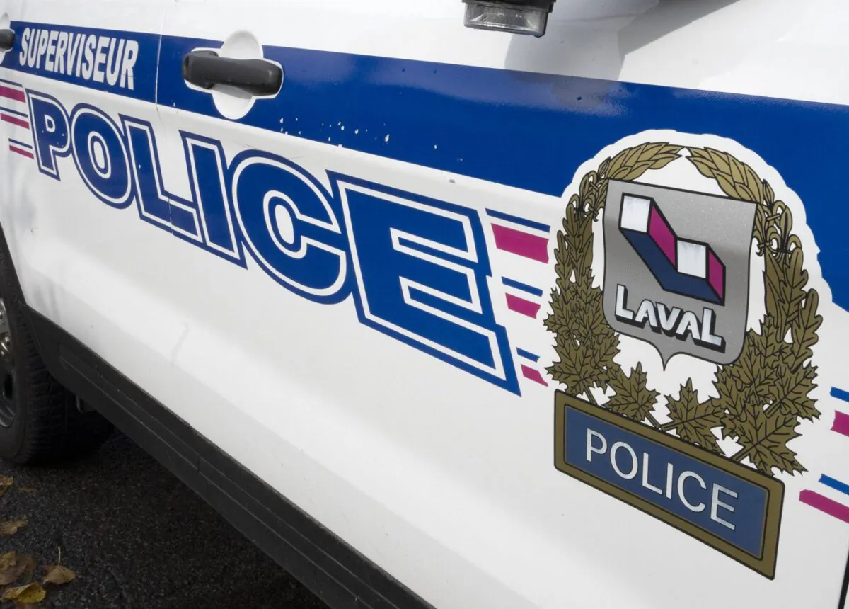 The Laval police logo is seen on a police car on Oct. 18, 2022 in Laval, Que. (The Canadian Press/Ryan Remiorz)
