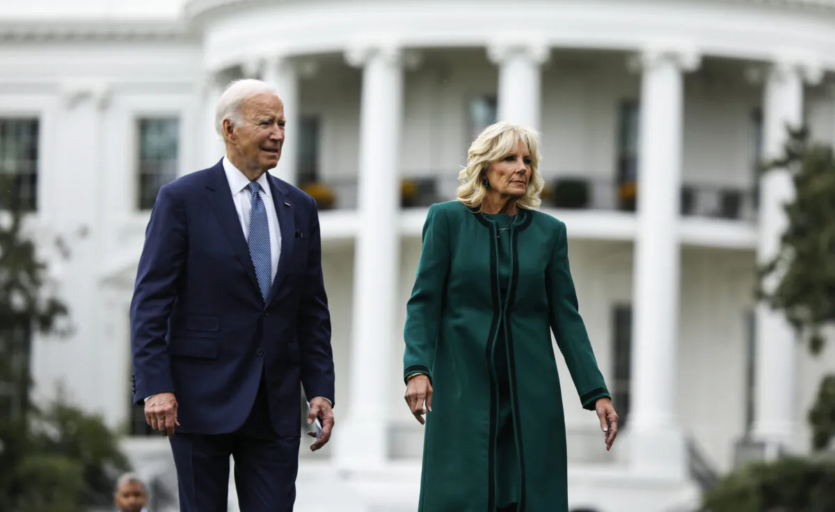 President Joe Biden and first lady Jill Biden walk on the South Lawn to a tree planting ceremony for Dale Haney, the White House grounds superintendent, in Washington on Oct. 24, 2022. (Anna Moneymaker/Getty Images)