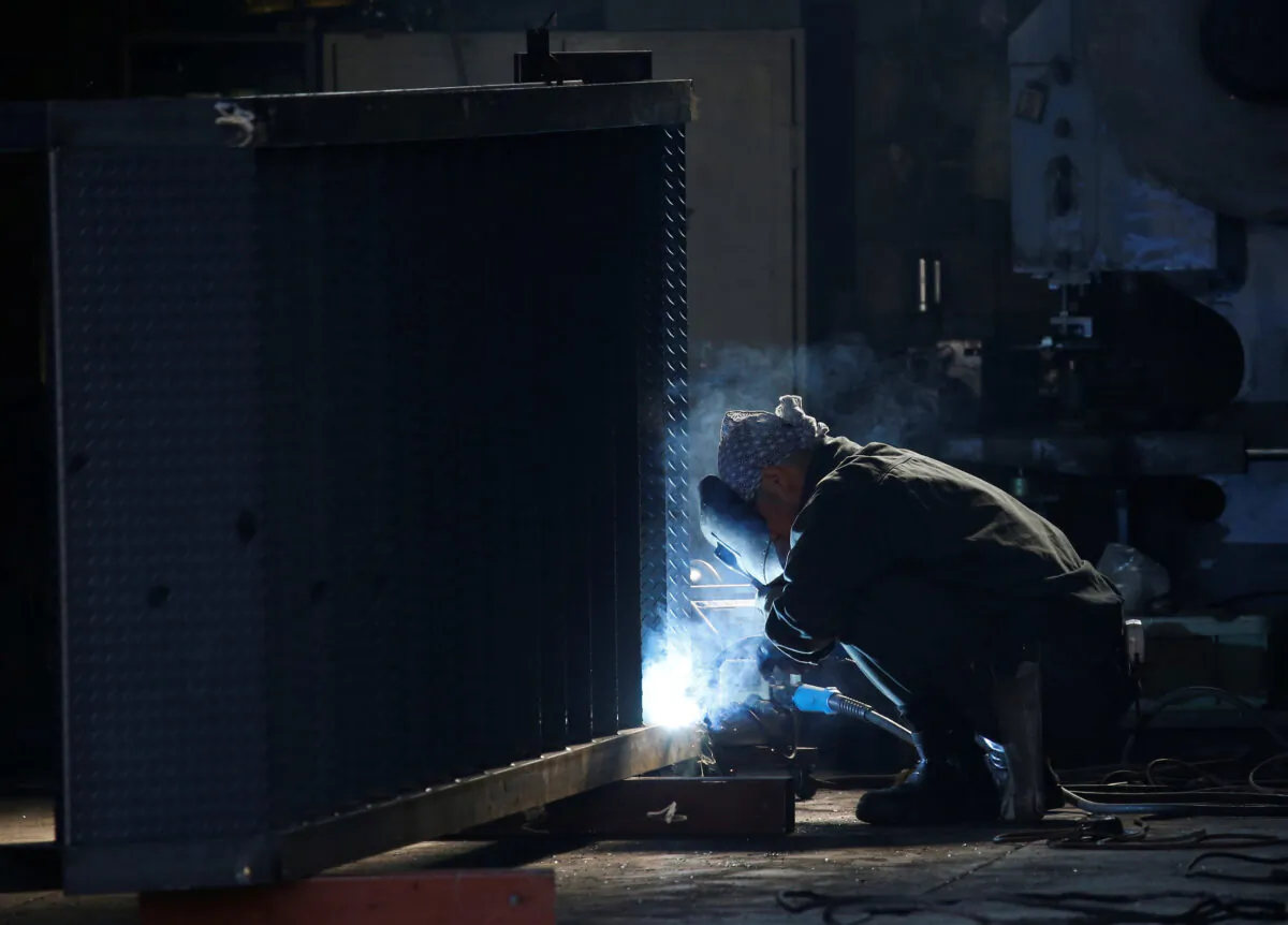 A man works at a factory at the Keihin industrial zone in Kawasaki, Japan, on Feb. 28, 2017. (Issei Kato/Reuters)