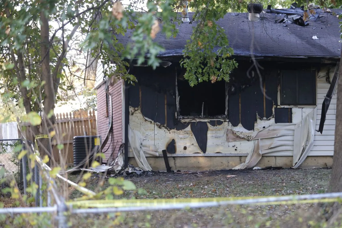 A basketball goal stands on the street in front of the house in the 400 block of South Hickory Avenue where eight people died in an apparent murder-suicide involving two adults and six children in Broken Arrow, Okla., on Oct. 28, 2022. (Mike Simons/Tulsa World via AP)