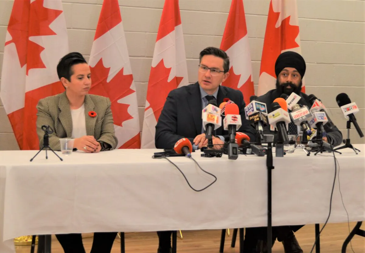 Conservative Leader Pierre Poilievre (C) speaks to reporters at a press conference in Mississauga, Ont., on Oct. 30, 2022. He is accompanied by his party's deputy leader Melissa Lantsman (L) and finance critic Jasraj Singh Hallan (R). (Omid Ghoreishi/The Epoch Times)