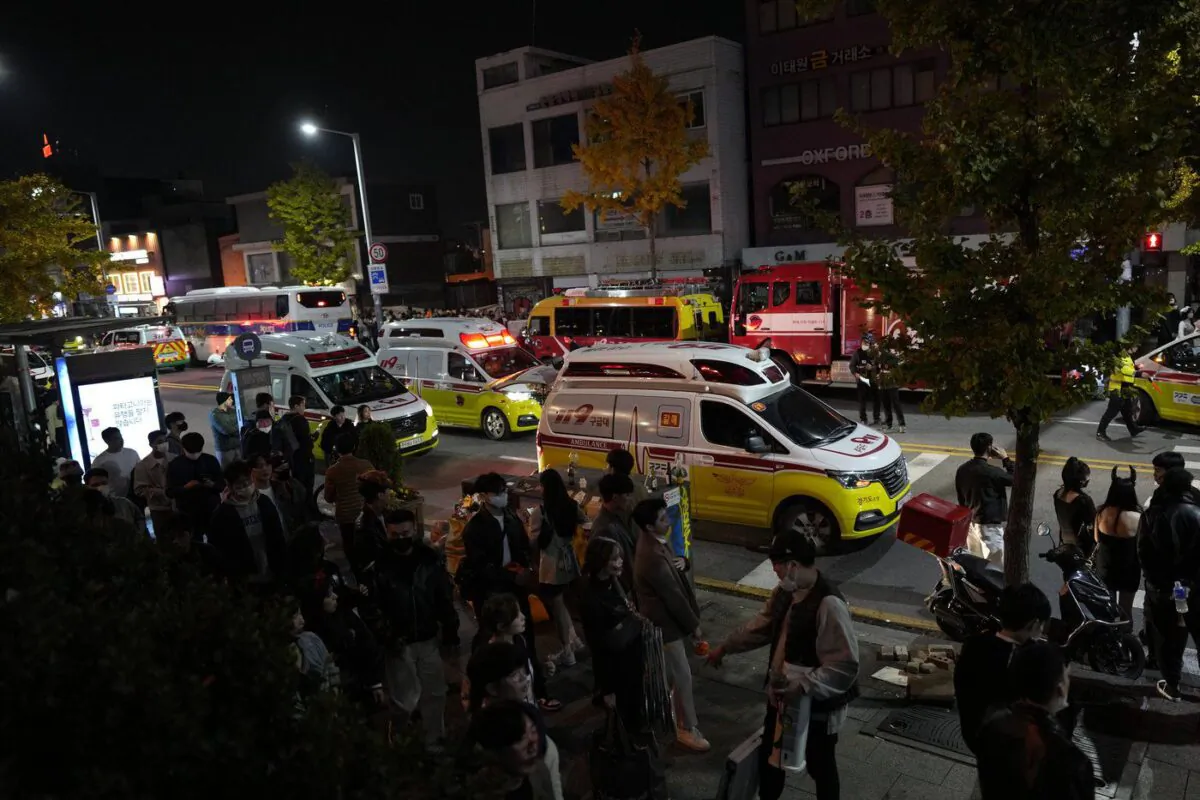 Ambulances carrying victims head to the hospital near the scene in Seoul, South Korea, Oct. 30, 2022. (The Canadian Press/AP-Lee Jin-man)