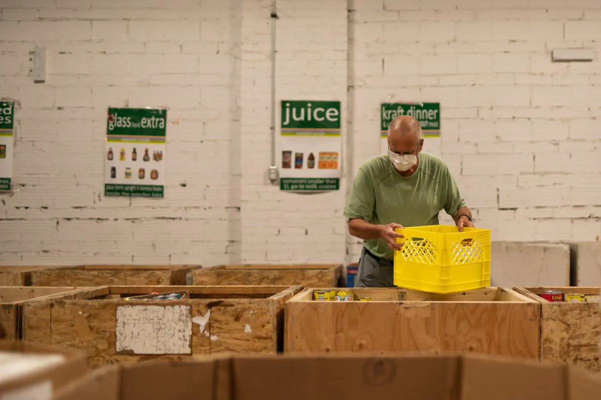 A volunteer sorts through food items at the Saskatoon Food Bank and Learning Centre in a Sept. 2021, handout photo. (The Canadian Press/Saskatoon Food Bank and Learning Centre)