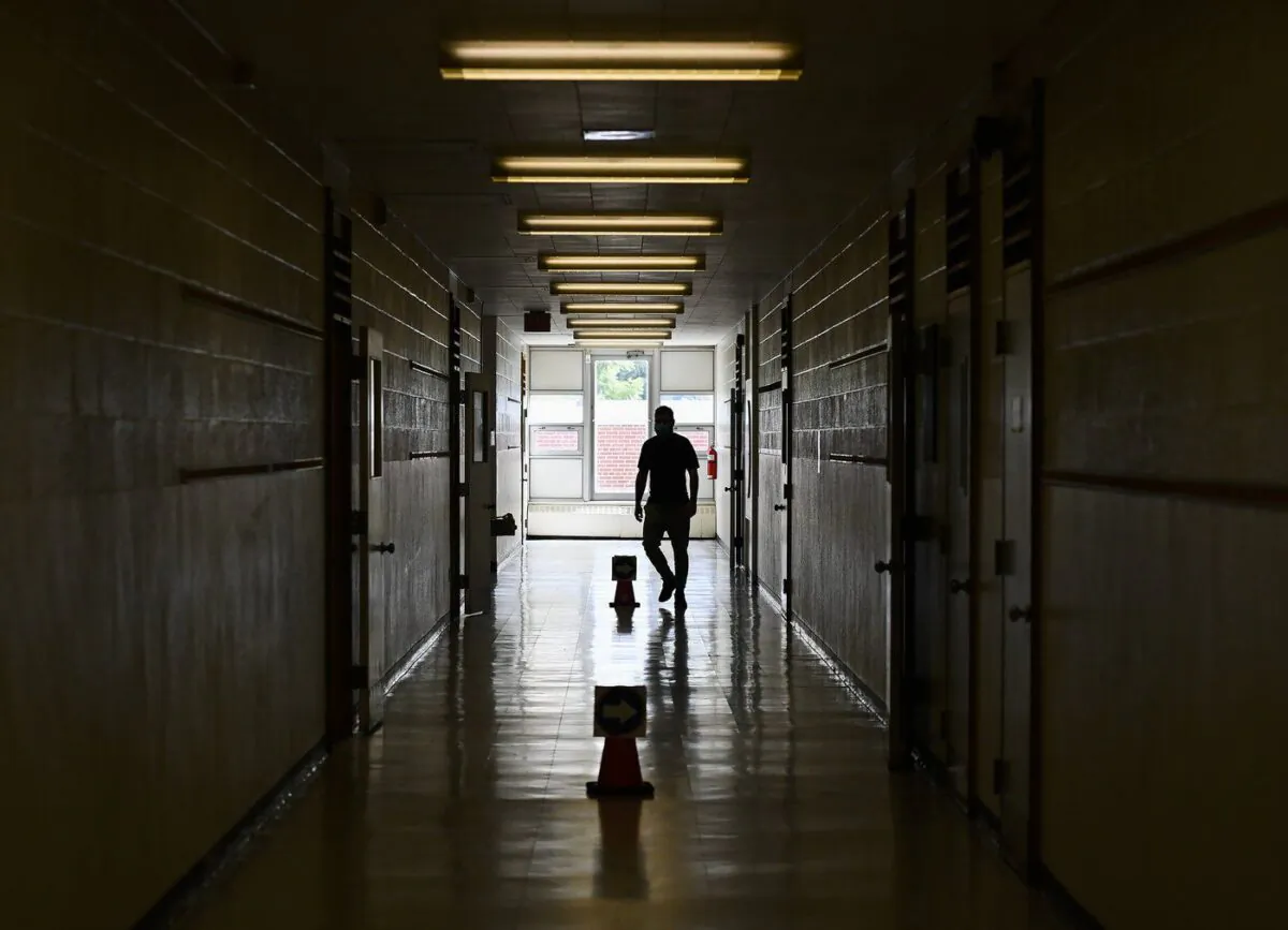 A person walks in the hall at a school in Scarborough, Ont., in a file photo. (The Canadian Press/Nathan Denette)