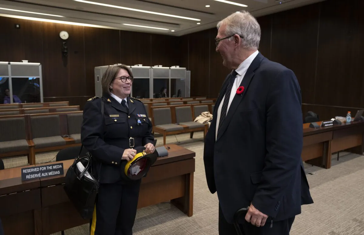 Emergency Preparedness Minister Bill Blair speaks with RCMP Commissioner Brenda Lucki at the Standing a committee on Public Safety and National Security, in Ottawa on Oct. 31, 2022. (The Canadian Press/Adrian Wyld)