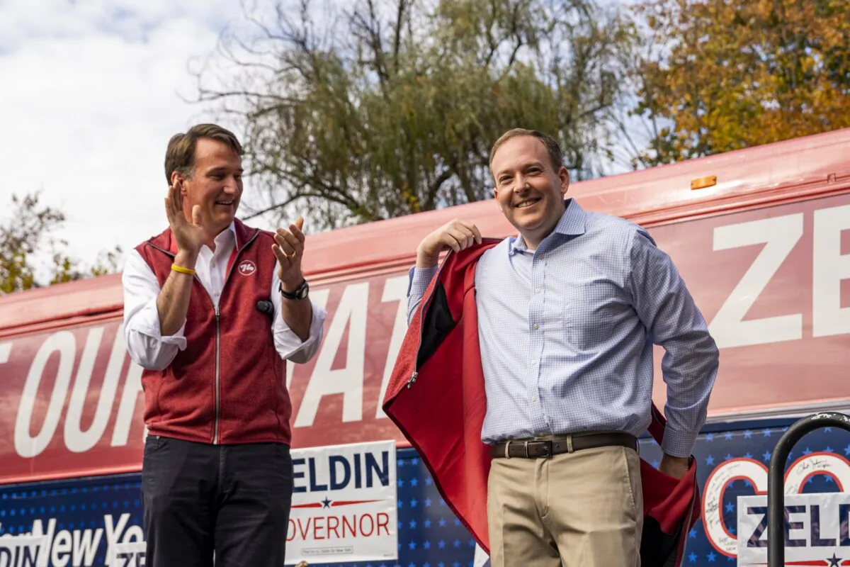 Virginia Gov. Glenn Youngkin (L) and Republican gubernatorial nominee Rep. Lee Zeldin (R-N.Y.) appear on stage at a “Get Out the Vote Rally” in Thornwood, Westchester county in New York, on Oct. 31, 2022. (Chung I Ho/The Epoch Times)

