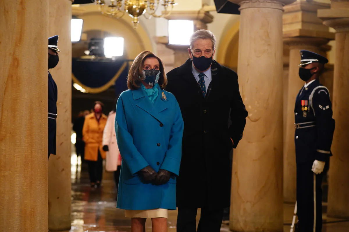 Speaker of the House Nancy Pelosi and her husband Paul Pelosi arrive in the Crypt of the US Capitol for President-elect Joe Biden's inauguration ceremony to be the 46th President of the United States on Jan. 20, 2021, in Washington. (Jim Lo Scalzo-Pool/Getty Images)
