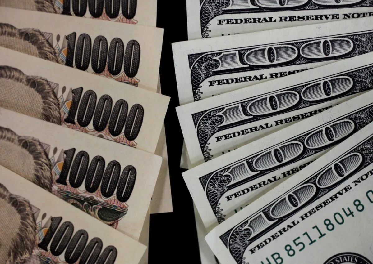 A picture illustration shows U.S. 100 dollar banks and Japanese 10,000 yen notes taken in Tokyo on Aug. 2, 2011. (Yuriko Nakao/Reuters)