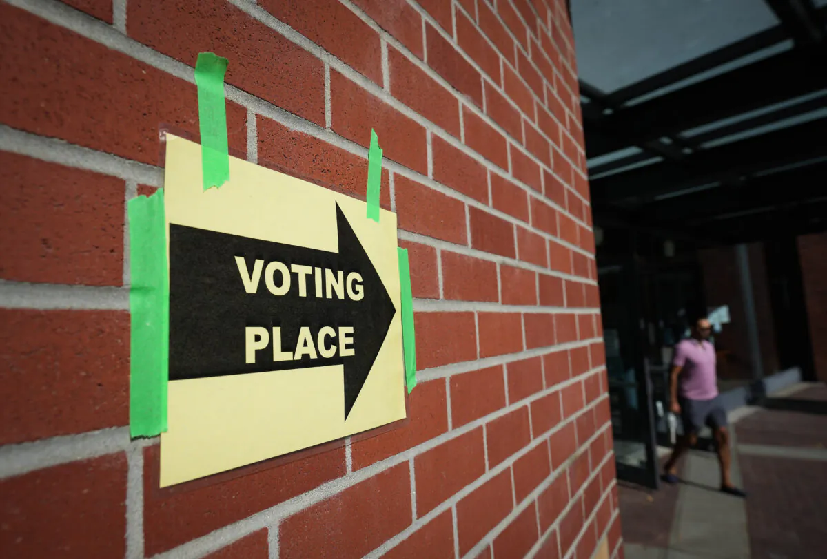 A man leaves a civic election polling station in Vancouver on Oct. 15, 2022. (The Canadian Press/Darryl Dyck)