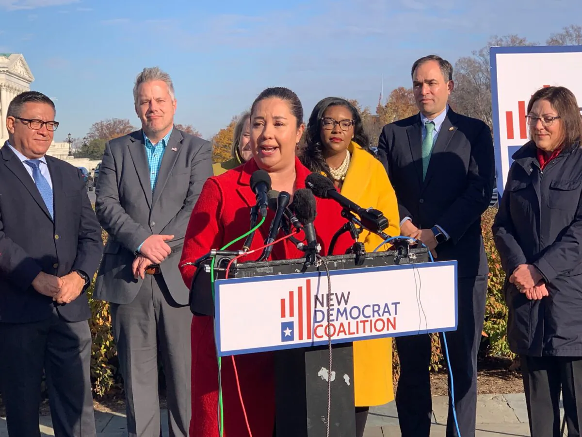 The New Democrat Coalition holds a press conference outside the Capitol in Washington on Dec. 2, 2022. (Chen Lei/NTD)