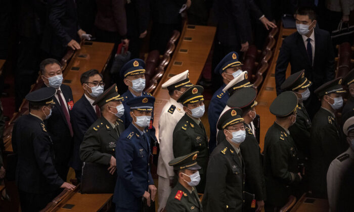 Chinese military delegates leave the closing session of the 20th National Congress of the Communist Party of China at The Great Hall of the People in Beijing, on October 22, 2022. (Kevin Frayer/Getty Images)