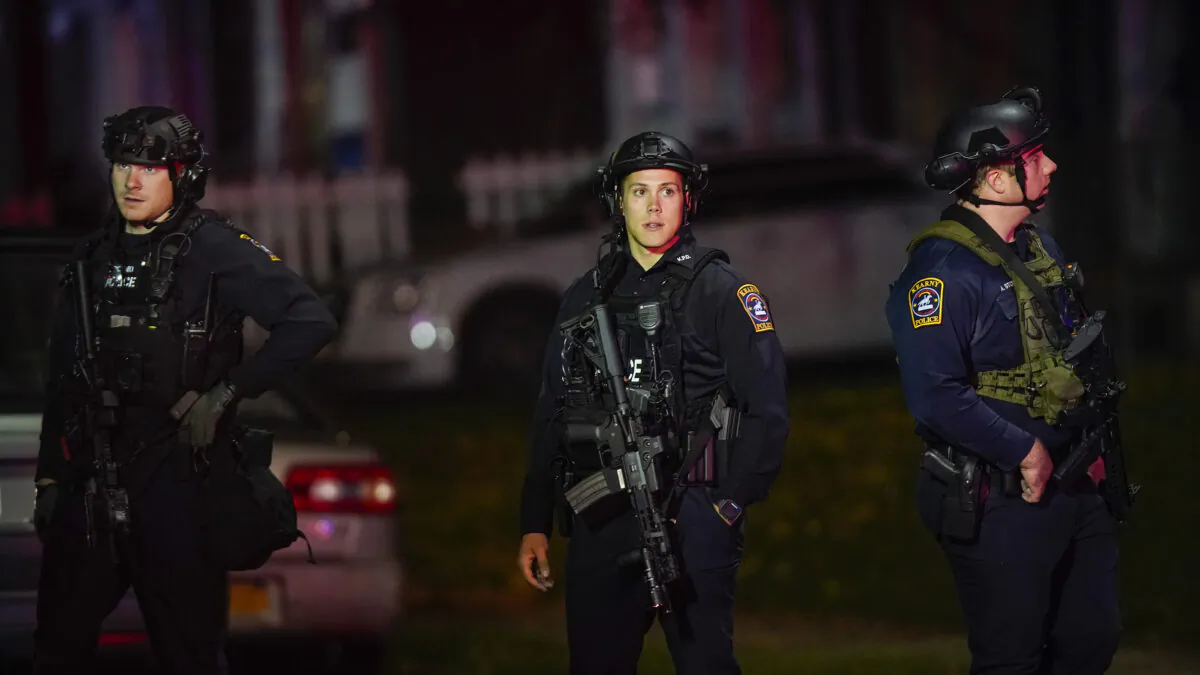 Law enforcement personnel gather at the scene where two officers were reported shot in Newark, N.J., on Nov. 1, 2022. (Eduardo Munoz Alvarez/AP Photo)