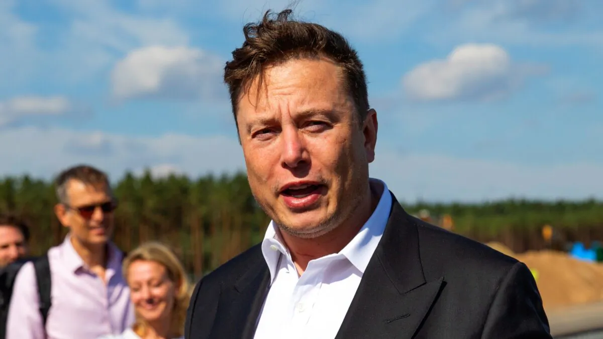 Tesla head Elon Musk talks to the press as he arrives to have a look at the construction site of the new Tesla Gigafactory near Berlin, on Sept. 3, 2020. (Maja Hitij/Getty Images)