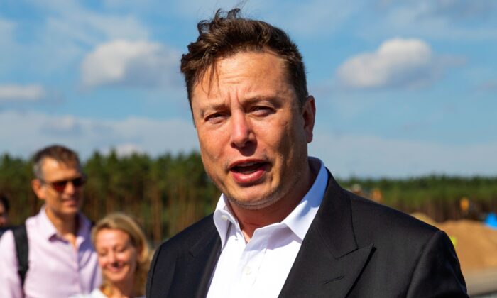 Tesla head Elon Musk talks to the press as he arrives to have a look at the construction site of the new Tesla Gigafactory near Berlin, on Sept. 3, 2020. (Maja Hitij/Getty Images)