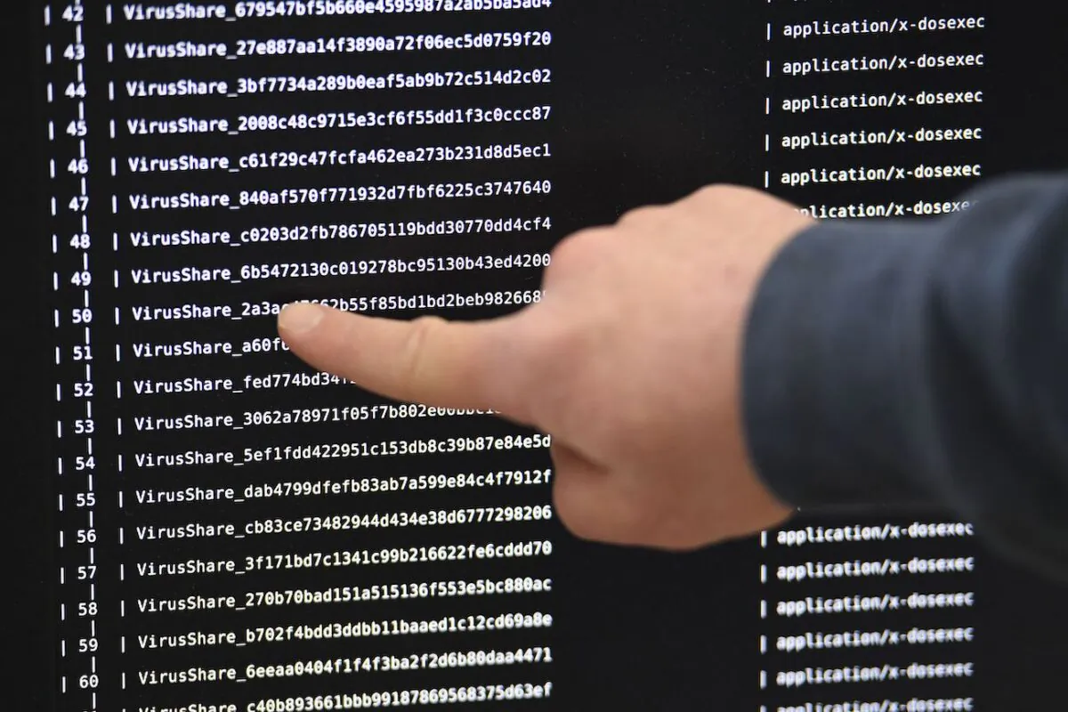 An IT researchers shows on a giant screen a computer infected by a ransomware at the National Institute for Research in Computer Science and Automation in Rennes, France, on Nov. 3, 2016. (Damien Mayer/AFP via Getty Images)
