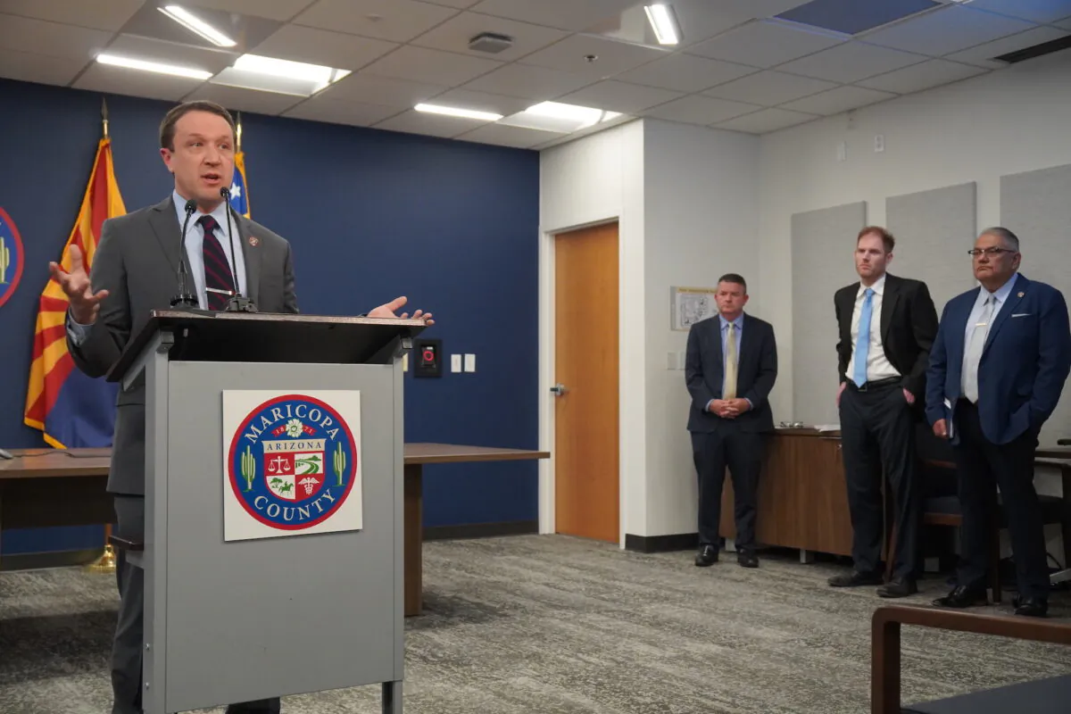 Maricopa County, Ariz., Director of Elections Scott Jarrett (L) talks about midterm election procedures during a press conference in Phoenix on Nov. 2, 2022. (Allan Stein/The Epoch Times)