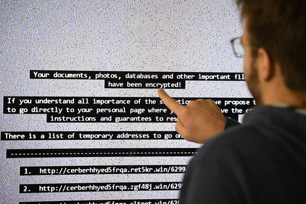 An IT researchers shows on a giant screen a computer infected by a ransomware at the LHS (High Security Laboratory) of the INRIA (National Institute for Research in Computer Science and Automation) in Rennes, France, on Nov. 3, 2016. (Damien Meyer/AFP via Getty Images)