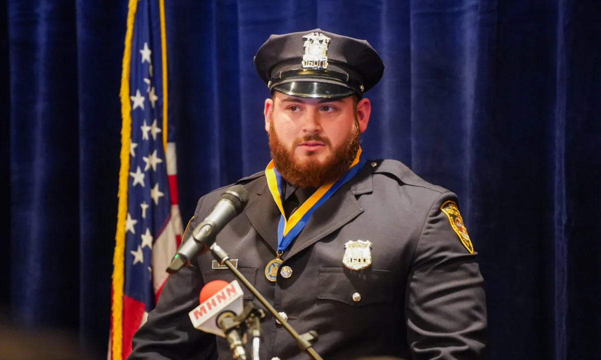 Middletown Police Officer Evan Barone speaks after being presented with the award of New York State Police Officer Medal of Valor at Paramount Theatre in Middletown, N.Y., on Nov. 1, 2022. (Cara Ding/The Epoch Times)