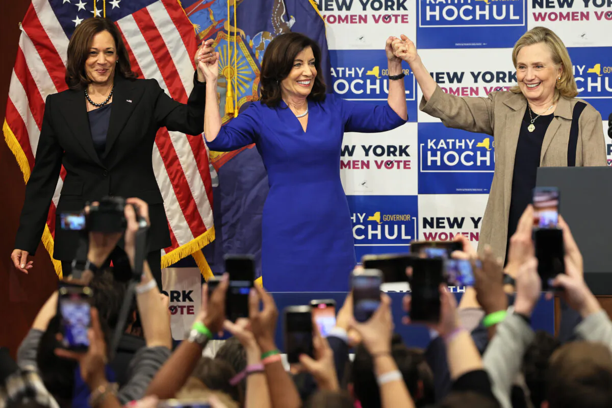 Vice President Kamala Harris (L), New York Gov. Kathy Hochul (C), and former Secretary of State Hillary Clinton (R) hold up their hands at the conclusion of a New York Women “Get Out The Vote” rally at Barnard College in New York on Nov. 3, 2022. (Michael M. Santiago/Getty Images)