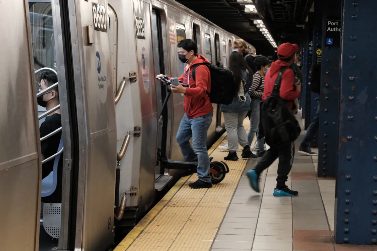 People walk through a Manhattan subway station in New York on May 24, 2022. (Spencer Platt/Getty Images)