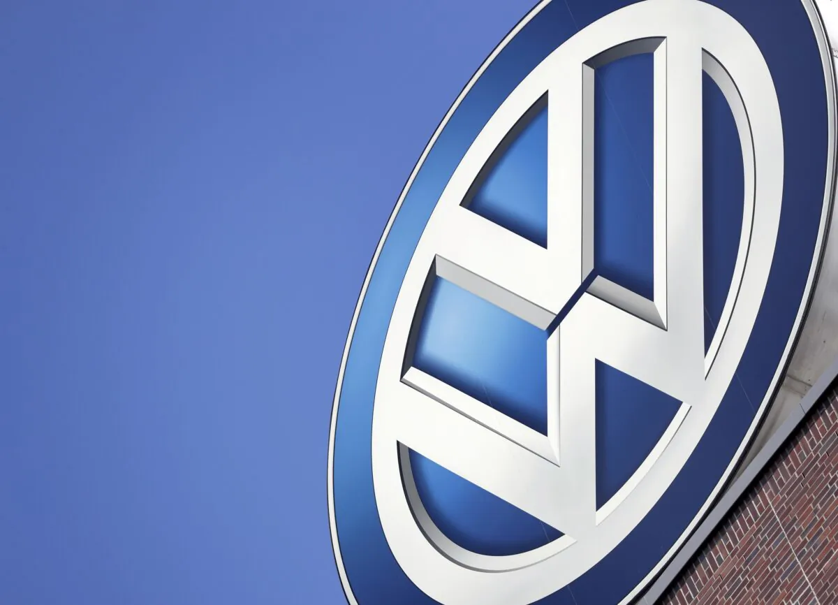 A logo of the brand Volkswagen on top of a company building prior to a Volkswagen stock company press conference in Wolfsburg, Germany, on Aug. 1, 2018. (Michael Sohn/AP Photo)