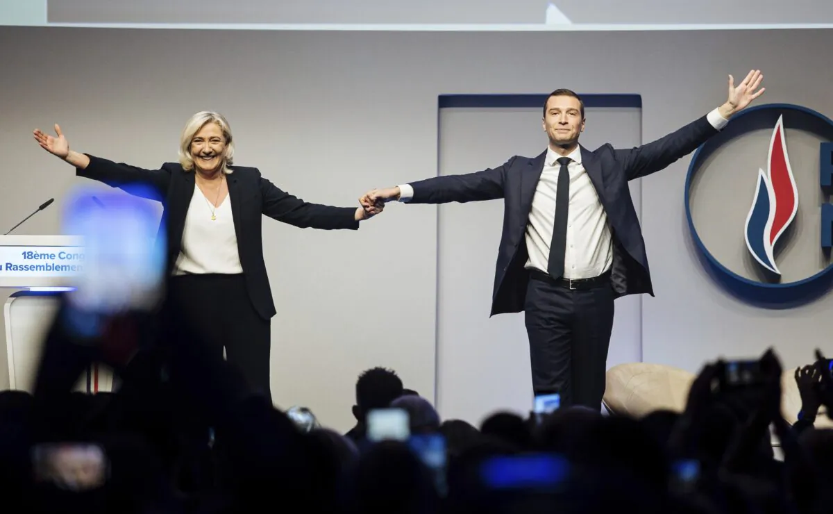 French right leader Marine Le Pen celebrates with newly elected leader of the National Rally president Jordan Bardella during the party congress in Paris, on Nov. 5, 2022. (Lewis Joly/AP Photo)