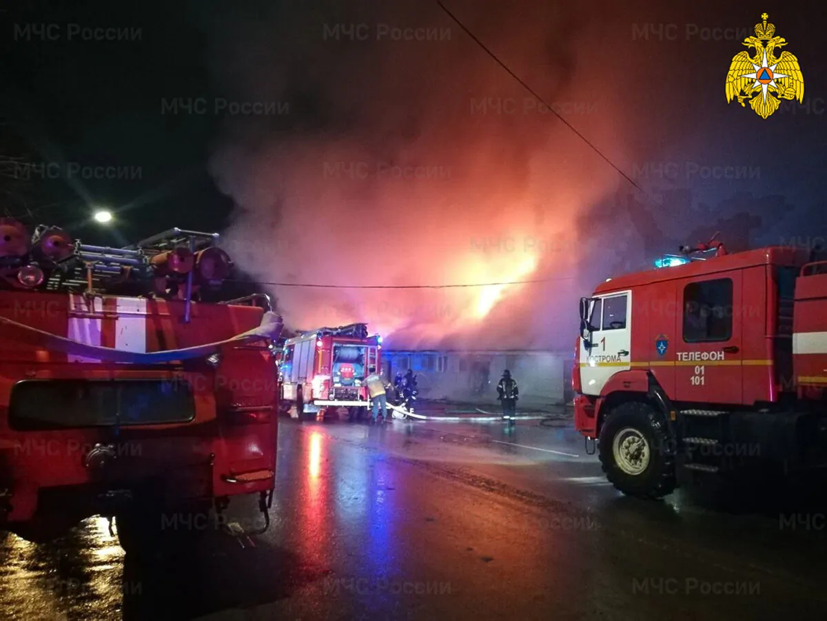 In this handout photo firefighters try to extinguish a fire at a cafe in Kostroma, Russia, on Nov. 5, 2022. (Russian Emergency Ministry Press Service via AP)